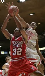 New Mexico's J.R. Giddens goes to block a shot by Texas Tech's Mike Singletary in the first half. (AP Photo/Jake Schoellkopf)