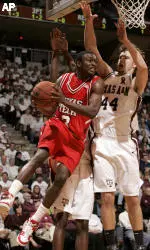 Martin Zeno drives for the basket while guarded by Texas A&M's Antanas Kavaliauskas.