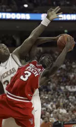 Martin Zeno battles with Texas center Dexter Pittman during the first half.