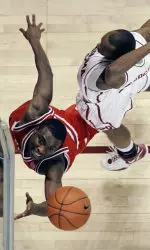 Martin Zeno shoots in from of Oklahoma guard Tony Crocker during the first half.