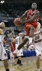 Texas Tech's Martin Zeno drives to the basket past the defense of Boston College's Tyler Roche (22) and Sean Marshall, left. (AP Photo/David J. Phillip)