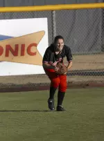 Freshman Leah Legler in left field before it became a swamp