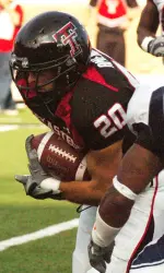 Danny Amendola (20) runs past UTEP's Josh Ferguson (2) after a short pass reception in the first quarter. (AP Photo/Lubbock Avalanche-Journal, Joe Don Buckner)