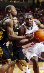 Martin Zeno turns into Missouri's Keon Lawrence for a shot in the first half.