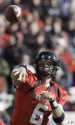 Graham Harrell lets a pass fly during the first half. (AP Photo/LM Otero)