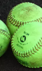 Improvements to softball complex may include ball holders.