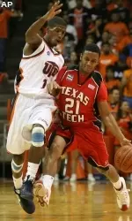 John Roberson drives against UTEP's Stefon Jackson during the first half.