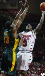Martin Zeno attempts a shot against Baylor's Kevin Rogers. (AP Photo/Lubbock Avalanche-Journal, Joe Don Buckner)