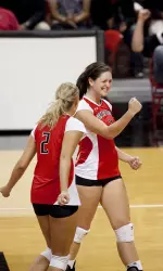 Karlyn Meyers and Caroline Courntey celebrate a point versus Baylor