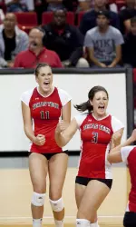 Amanda Dowdy and Karlyn Meyers celebrate a point