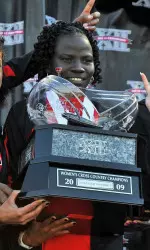 Lillian Badaru with the Big 12 Cross Country Championship Trophy.