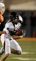 Austin Zouzalik runs from Oklahoma State defenders in the first half.