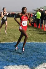All-American Purity Biwott running through the finish line at the NCAA Cross Country Championships