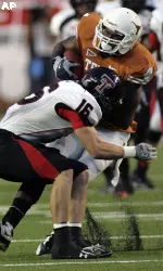 Texas Tech safety Cody Davis (16) puts to stop on Texas wide receiver Dan Buckner.