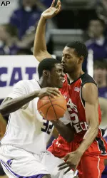 Kansas State forward Jamar Samuels (32) is guarded by Texas Tech forward D'walyn Roberts (5) during the first half. (AP Photo/Orlin Wagner)