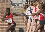Gladys Kipsang handing off to Lillian Bardaru during the distance medley relay at the Penn Relays