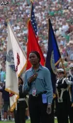 U.S. Army Specialist Danielle Green sings "God Bless America."