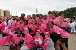 The Lady Raiders took photos with some of the survivors prior to the start of the race.