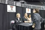 Kristy Curry, Jordan Barncastle and Monique Smalls at Big 12 Media Day at the Sprint Center in Kansas City.