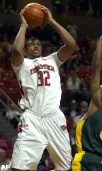 Texas Tech's Mike Singletary, left, scores while being fouled by Baylor's Fred Ellis during the first half of an NCAA college basketball game Tuesday, March 2, 2010, in Lubbock, Texas. (AP Photo/Geoffrey McAllister)
