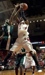 Brad Reese, right, pulls down a rebound over Jacksonville's Travis Cohn during the second half. (AP Photo/ Lubbock Avalanche-Journal, Geoffrey McAllister)