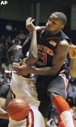 Texas Tech guard Nick Okorie looses the ball after crashing into Mississippi forward Terrance Henry in the first half