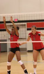 Justine Young (19) and Amanda Dowdy were a part of the winning red squad at Friday's intersquad scrimmage.