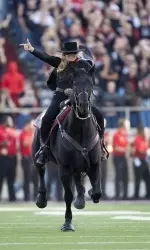 The Masked Rider leads the team on the field prior to last season's game against Texas A&M