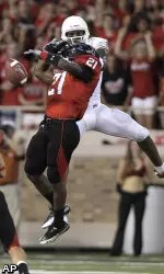 Texas Tech cornerback Jarvis Phillips breaks up the pass intended for Texas wide receiver Malcolm Williams.
