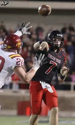 Seth Doege throws under pressure from Iowa State's Jake Knott.