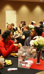 The Rowdy Raiders had dinner with the basketball coaches and players at the United Spirit Arena.