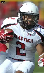 Texas Tech's Cornelius Douglas, center, braces for impact as he carries the ball for extra yardage against the New Mexico's Carmen Mesina, left, and Devonta Tabannah.