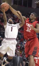 Jordan Tolbert, who scored 10 points in the game, blocks a shot.