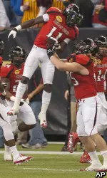 Texas Tech's Jakeem Grant (11) celebrates with Blake Dees