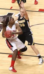 Texas Tech's Christine Hyde, left, works against Missouri's Morgan Eye.