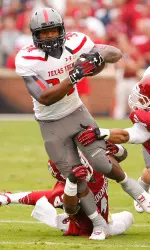 Kenny Williams attempts to break a tackle. (Alonzo Adams-USA TODAY Sports)