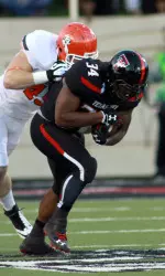 Kenny Williams (34) rushes in the first quarter. (Michael C. Johnson-USA TODAY Sports)