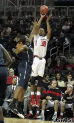 Jaye Crockett hits a three point shot.