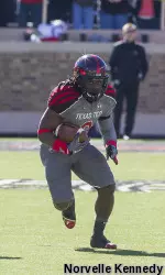 Sadale Foster carries the football.