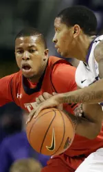 Kansas State guard Rodney McGruder (22) is covered by Toddrick Gotcher. (AP Photo/Orlin Wagner)
