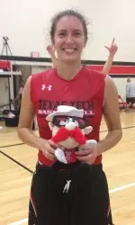 Paige Parliament poses with the Raider Red toy after being awarded practice player of the day.