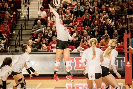 Emily Hill jumping, hitting