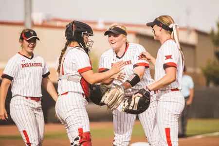 Team pitchers mound smiles