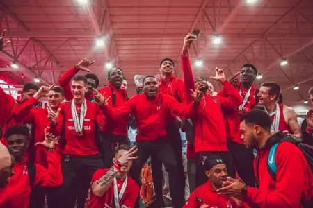 Divine Oduduru with Big 12 trophy