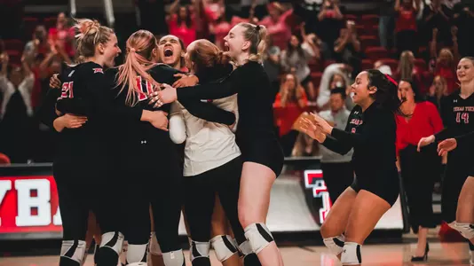 Volleyball celebrates win over Iowa State