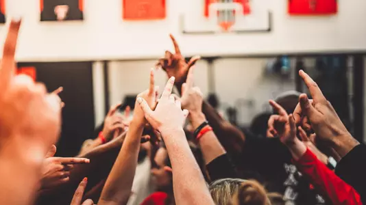 women's basketball team huddle