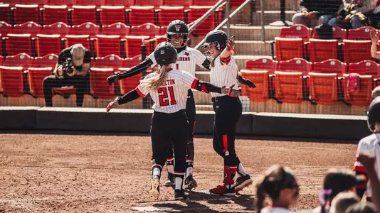 Zoe Jones and Heaven Burton hug Karli Hamilton