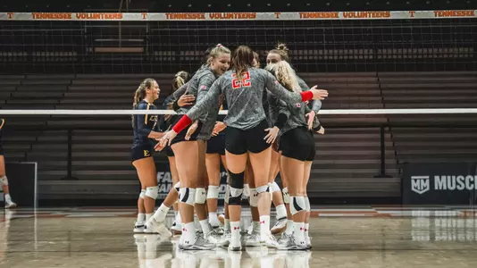 Volleyball team huddle against ETSU at Tennessee Classic