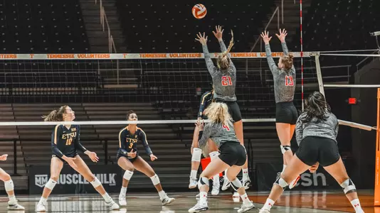 Brooke Kanas and Alex Kirby go up for a block against ETSU