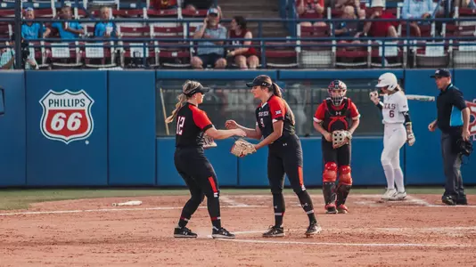 Ellie Bailey and Kendall Fritz shake hands at Big 12 Championship in OKC